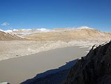 15 Glacial Lake On Gyabrag Glacier Just Before Cho Oyu Intermediate Camp As we drive from Chinese Base Camp (4908m) near Intermediate Camp, the road is directly above a large glacial lake. The two mountains in the distance are Labuche Kang and Lobuche Kang III E.